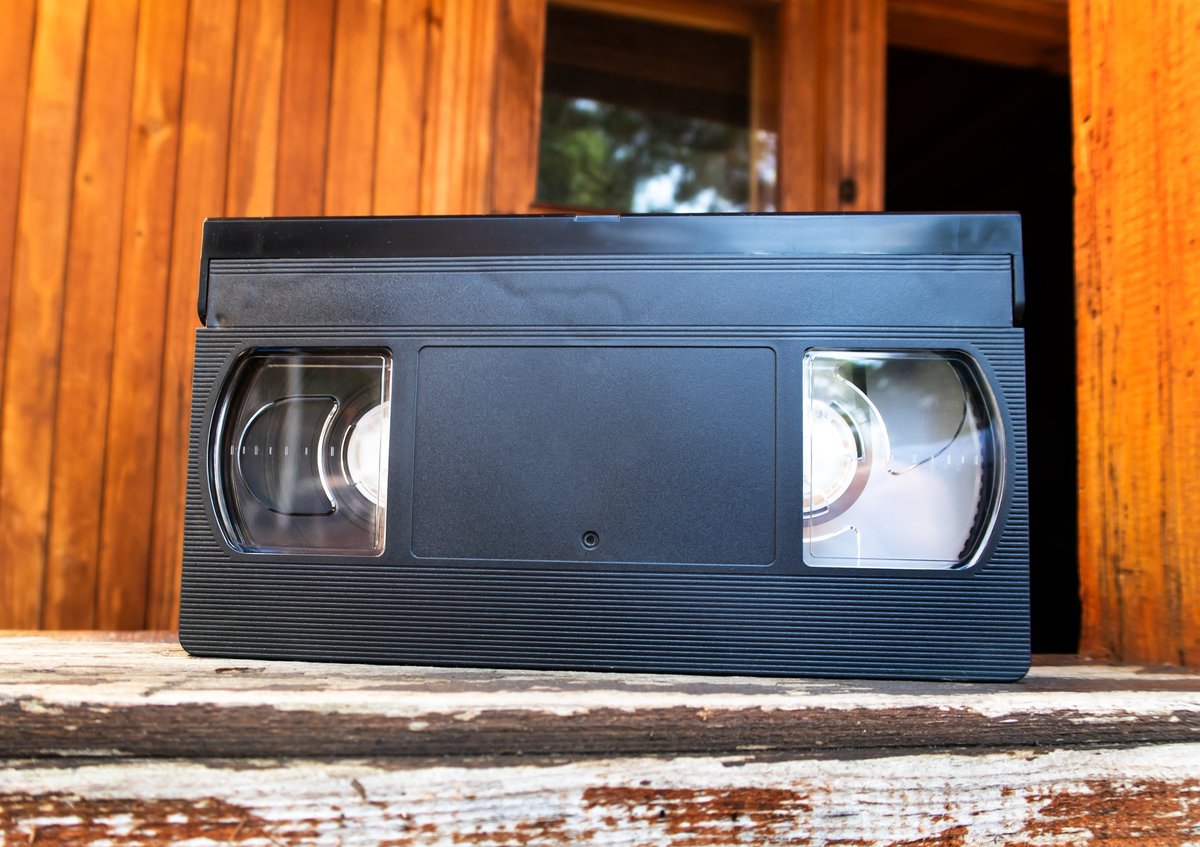 Retro video tape cassette on old wooden planks